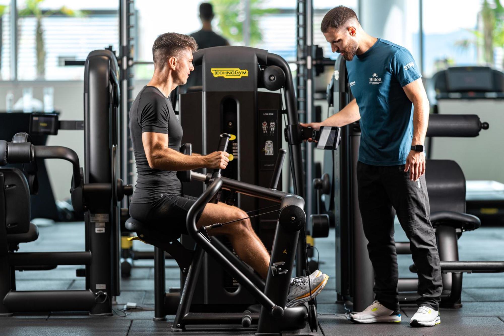 Hilton Rijeka Costabella Beach Resort And Spa Exteriör bild Personal trainer with a client